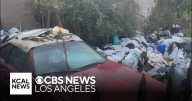 Garbage and junk return to Los Angeles home nicknamed "Trash House"