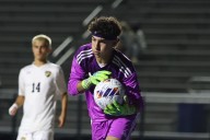 Soccer: Carson Solomon helps Andrew stop Sandburg in PKs