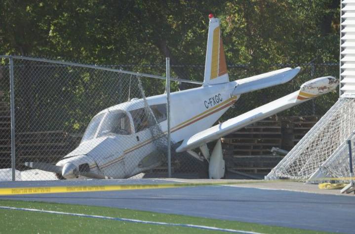 Three unhurt after plane crashes beside school's football field