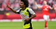 Dortmund beats Mainz 2-0 to keep pace with Bundesliga leader Bayern