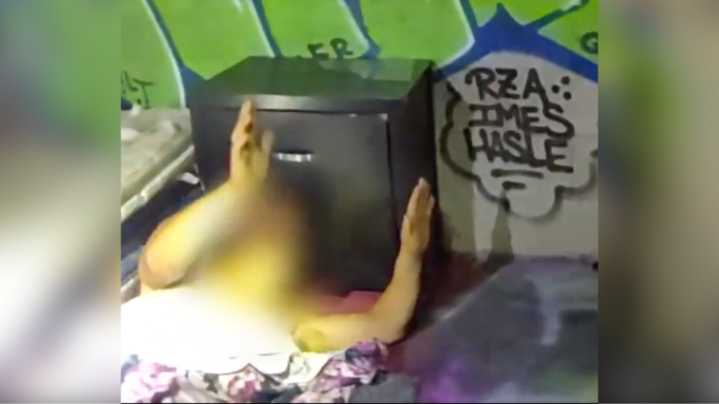Video: Suspect tries to hide from police under blanket in vacant building, still gets caught