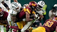 Commanders' Jayden Daniels will not play against the Raiders on Sunday because of an injured knee