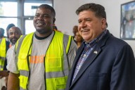 Gov. JB Pritzker scrubs photo with intervention worker after charges