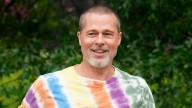 Brad Pitt looks incredibly fresh faced with long locks in latest photos