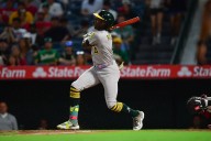 Deadspin | Seven-run inning propels A's past Angels