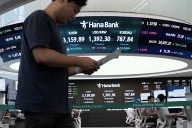 Asian shares are mixed and gold sets a fresh record high of over $3,550 per ounce