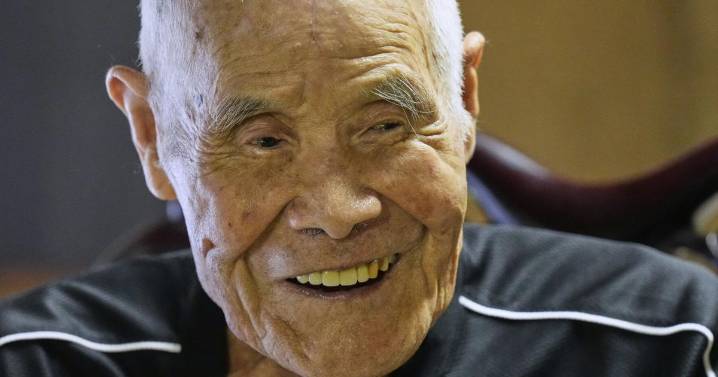 Japanese man becomes oldest to summit Mount Fuji at 102 with help from his family