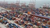 Shipping companies support a first-ever global fee on greenhouse gases, opposed by Trump officials