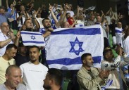 Israel soccer coach 'standing behind my country' amid calls for squad to be suspended