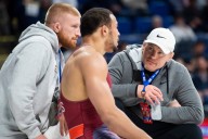 Penn State Rival Requests Coach Cael Sanderson to Return to Wrestling Roots at RAF 02