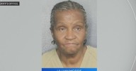Woman hired to take care of an elderly man accused of robbing him of his life savings