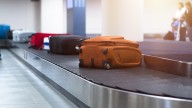 How to Avoid Paying for Checked Bags On Your Next Flight