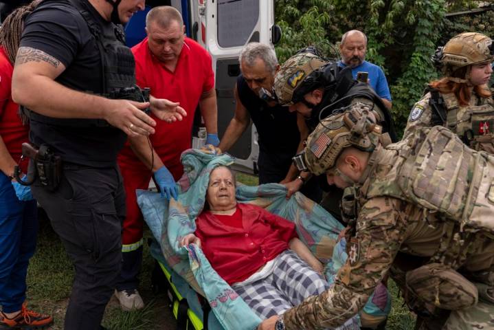 Russian glide bomb attack in eastern Ukraine kills at least 24 people waiting to collect pensions