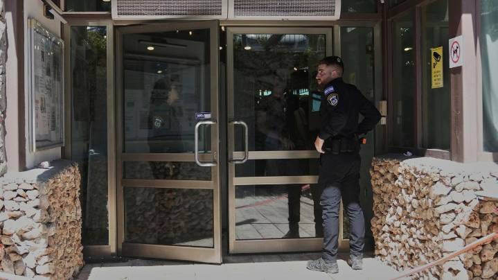 2 people are stabbed at a hotel outside Jerusalem. Israeli police say it's a militant attack