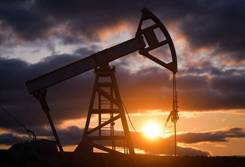Oil dips but holds near a month's high on US sanctions