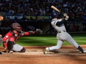 Reds lose 4-2 to the Brewers but end up in playoffs anyway after Mets fall