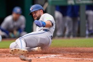 American League-best Blue Jays beat Royals 8-5 and clinch their 1st postseason berth since 2023
