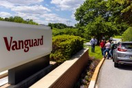 Vanguard to pay clients in conflict