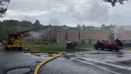 Firefighters extinguish 2-alarm fire in commercial building in Hopkinton