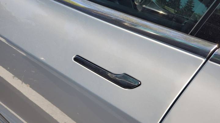 Tesla says it will redesign doors after reports of children being trapped