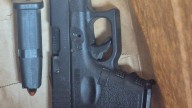 Mother charged after 3 kids found locked in truck with loaded gun at Florida gas station