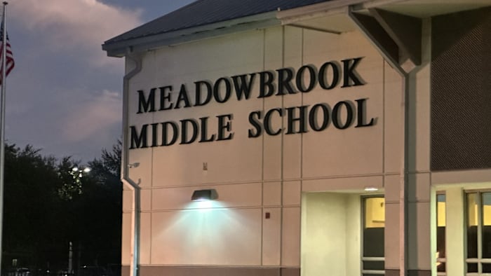 Man arrested after carrying gun on Orange County school campus amid open