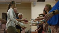 Jane Austen fans honor 250 years since her birth with grand costumed balls and dancing