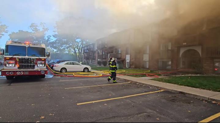 Crews working to put out fire at Muskegon apartment complex