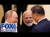 Putin, Modi and Xi cozy up at China summit