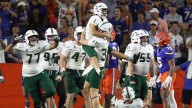 Florida defensive lineman Brendan Bratt was ejected for spitting on USF opponent