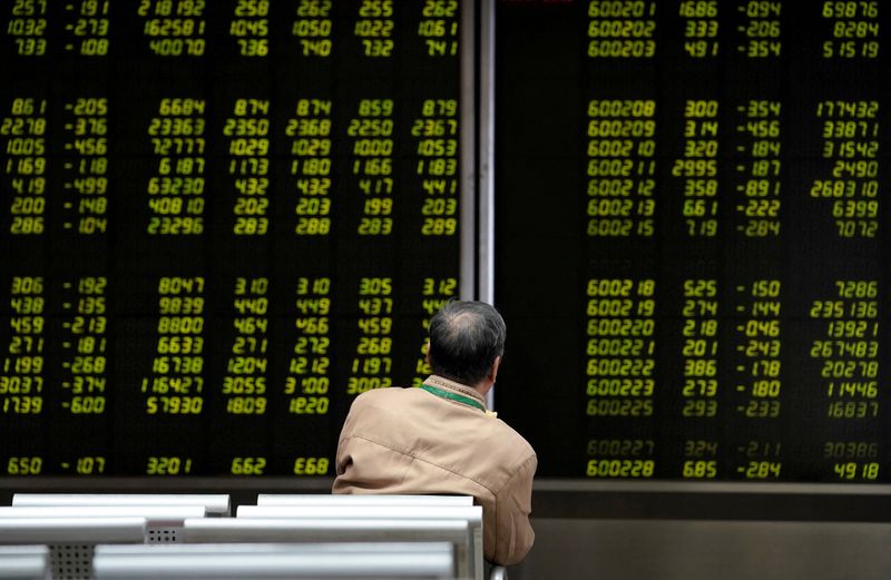 Asian shares to end big central bank week with gains, Nikkei hits record