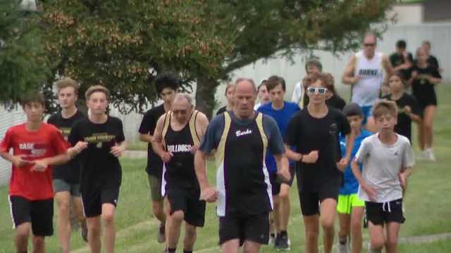 1975 Burke cross country team runs with current team
