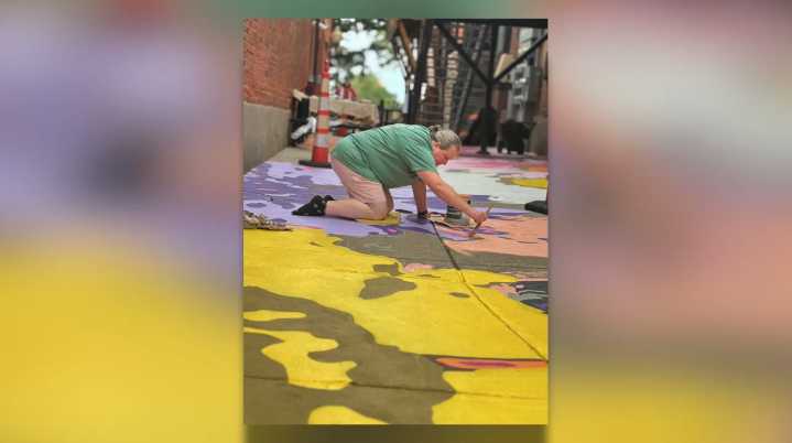 Saline residents paint colorful community mural on downtown sidewalks