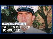 Killed Police Officer Remembered In Emotional Funeral As Hunt For Dezi Freeman Continues