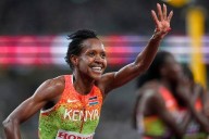 Kipyegon makes more history, wins in a breeze for fourth world title at 1,500 meters