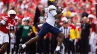 Michigan runs past Nebraska for 30