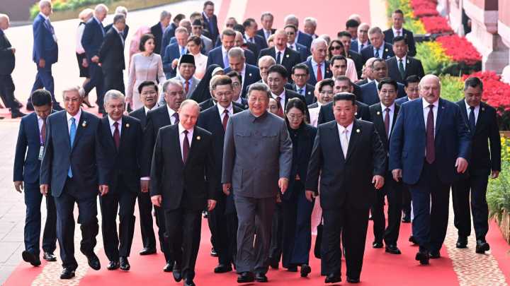 Putin, Xi and Kim stand side-by-side at China’s biggest ever army parade & warn world must choose between 'peace or WAR'