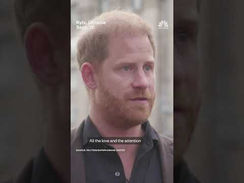 Prince Harry holds back tears while visiting makeshift memorial in Ukraine