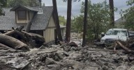 Mudslides trap drivers, bury roads and damage homes in Southern California