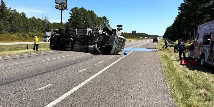 Tanker flips over, closing eastbound I