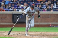 Nationals OF Daylen Lile (knee) exits after colliding with fence