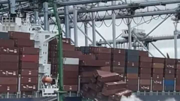 Shocking moment more than 60 shipping containers tumble off cargo ship & splash into sea like giant dominoes