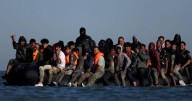 Britain suspends refugees' family reunion applications to toughen rules