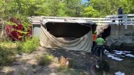 Small bridge gives way in Goffstown; Dump truck crashes into brook