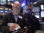 U.S. stocks churn amid uncertainty about rate cuts from the Fed
