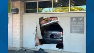 Fire and rescue crews respond after car crashes through Germantown Aldi wall