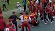 Commanders head coach Dan Quinn bloodied after sideline collision with star player in stunning scene