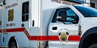 2 people possibly trapped in wash northwest of the Phoenix area