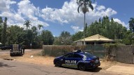 Partner of dead woman in custody and crime scene in place after grim find on front lawn near Darwin