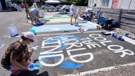 Parking spots used as colorful protest against Florida crackdown on rainbow crosswalks